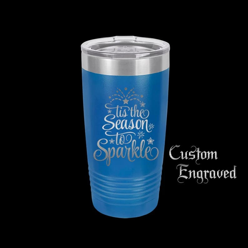 https://www.thedesigncraftstudio.com/cdn/shop/products/the-designcraft-studio-mugs-royal-blue-tis-the-season-to-sparkle-travel-mug-stainless-steel-powder-coated-gifts-for-her-christmas-mug-polar-camel-engraved-coffee-mug-35178217996449.jpg?v=1662038100&width=1445